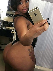 Sweet looking black girl taking selfies